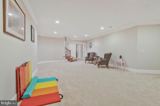 rec room featuring ornamental molding and light carpet