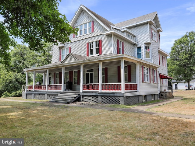 view of front of house with a front lawn and covered porch