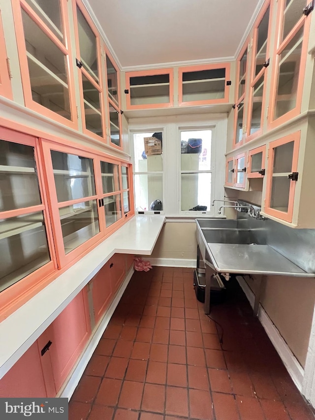 kitchen featuring dark tile patterned floors