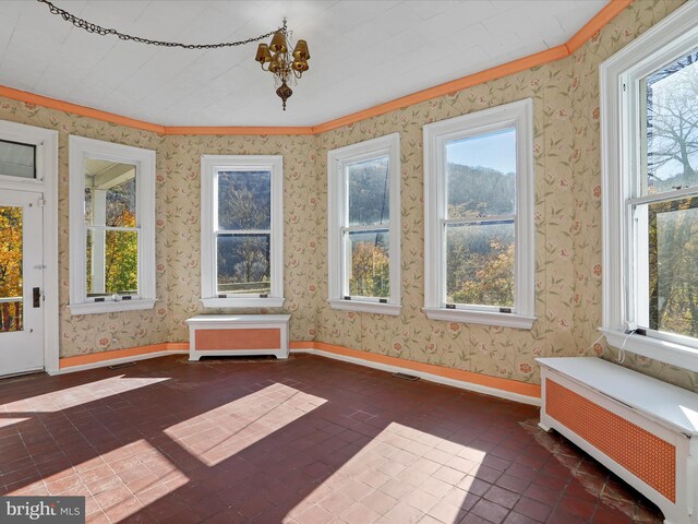 misc room with tile walls and sink