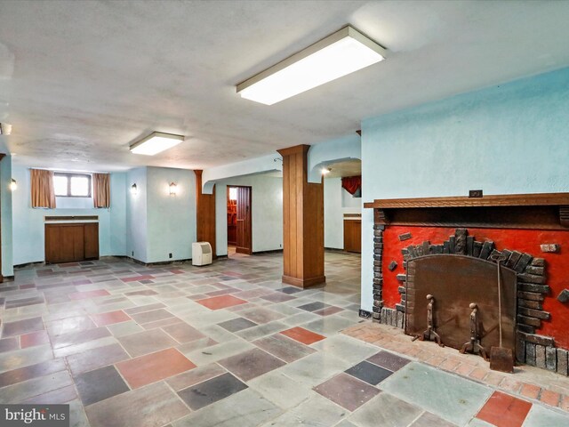 interior space featuring ornamental molding and radiator