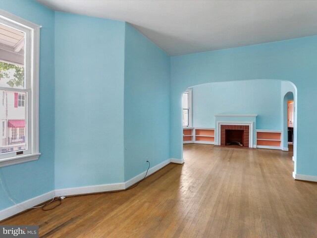 additional living space with dark wood-type flooring