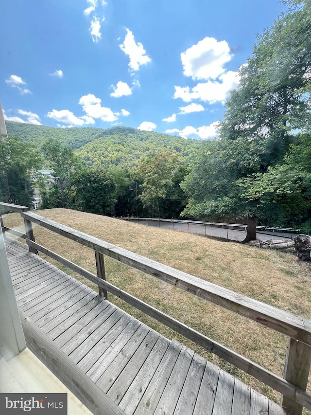 wooden deck with a yard