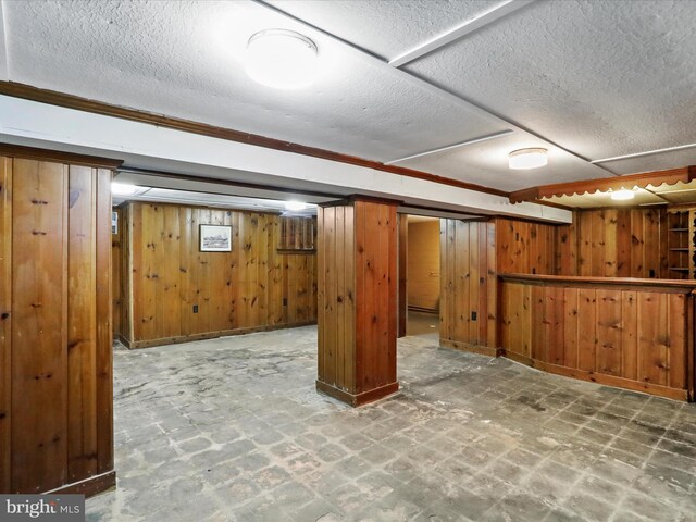 bar featuring wood walls