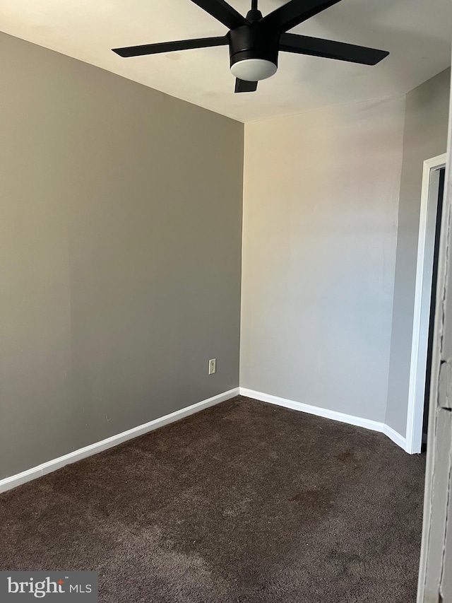 spare room with carpet flooring and ceiling fan