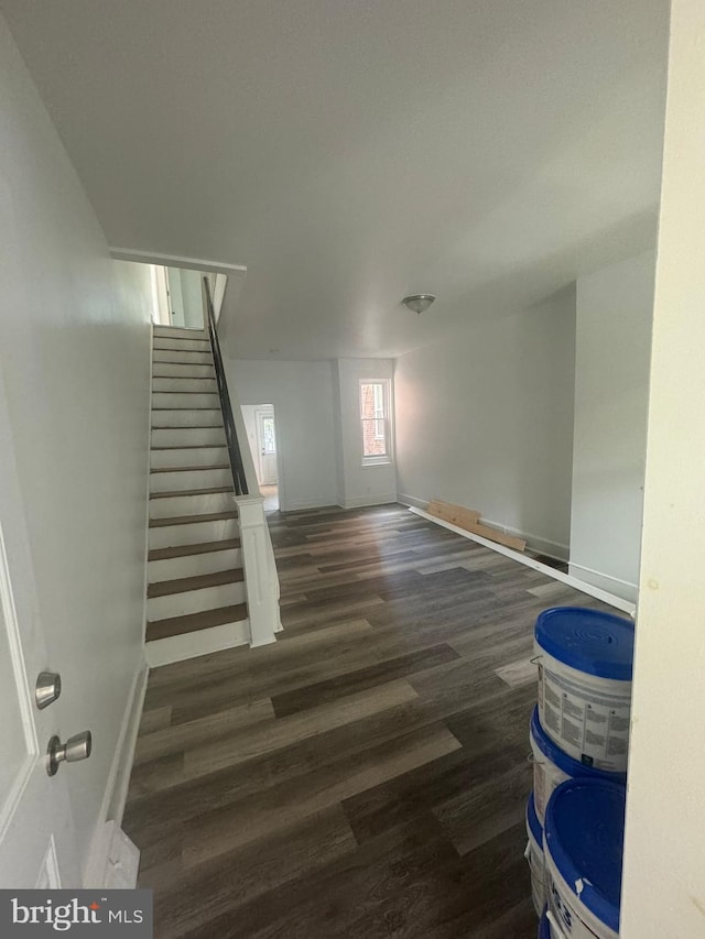 staircase with dark hardwood / wood-style floors