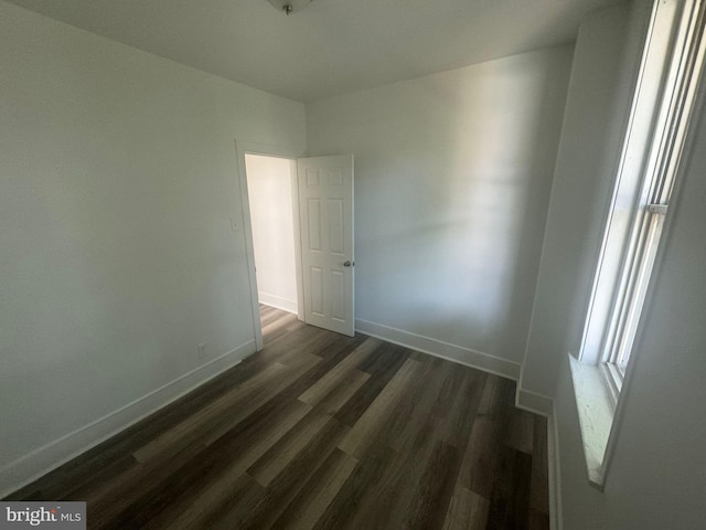 spare room featuring dark hardwood / wood-style floors