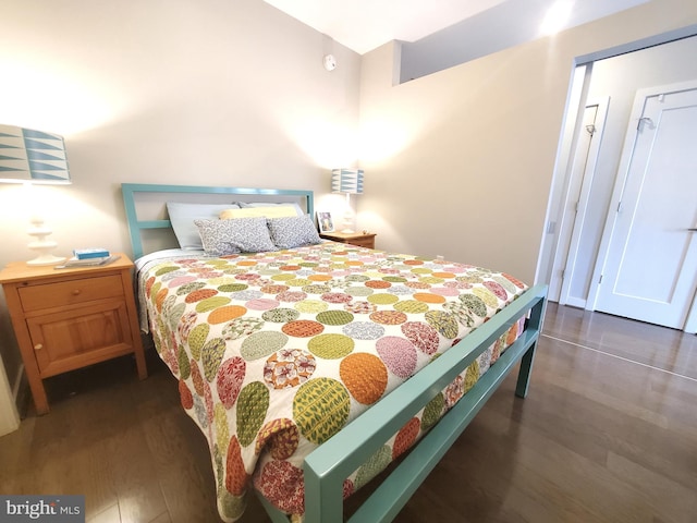 bedroom featuring dark hardwood / wood-style floors