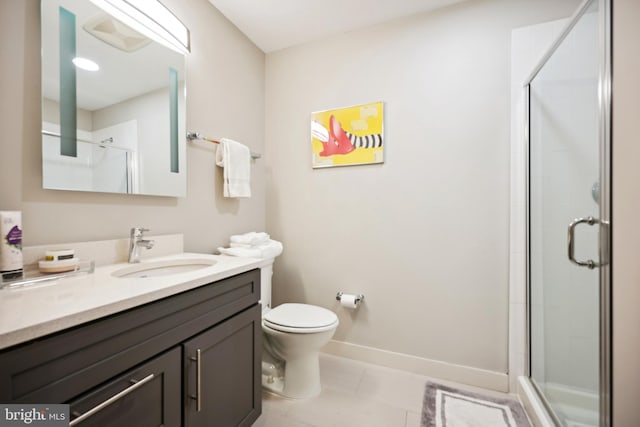 bathroom featuring vanity, tile patterned floors, toilet, and walk in shower