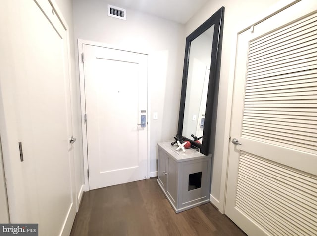 doorway with dark hardwood / wood-style floors