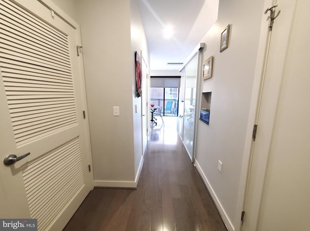 hallway featuring dark hardwood / wood-style flooring