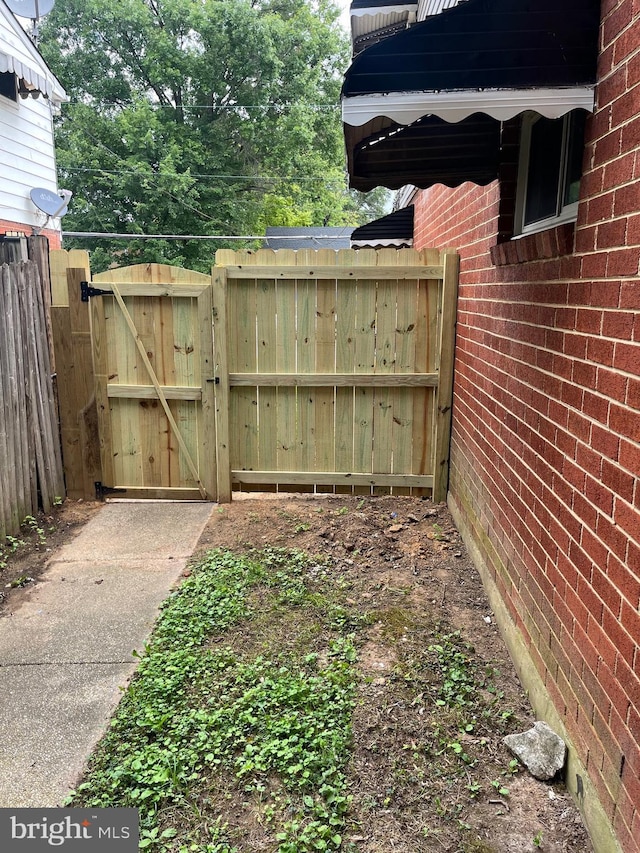 view of yard featuring a gate and fence