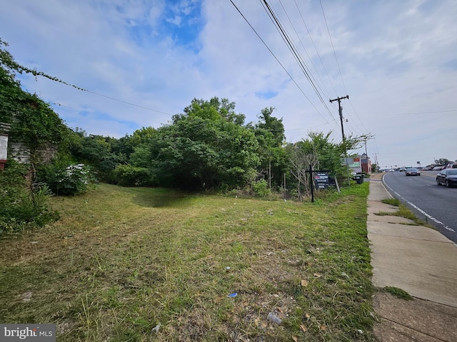 view of road with curbs and sidewalks