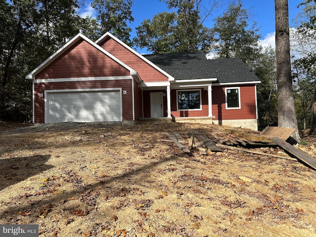 view of front of home with a garage and driveway