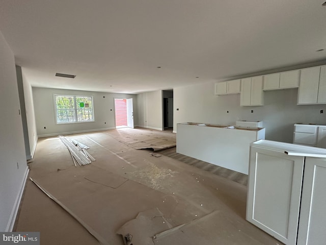 interior space featuring white cabinets