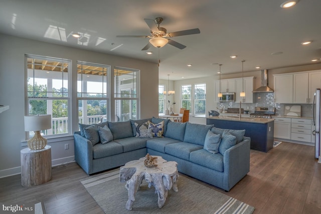 living room featuring baseboards, recessed lighting, dark wood-style floors, and a ceiling fan