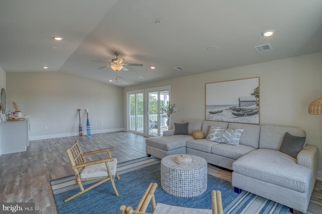 living room featuring wood-type flooring, ceiling fan, and lofted ceiling