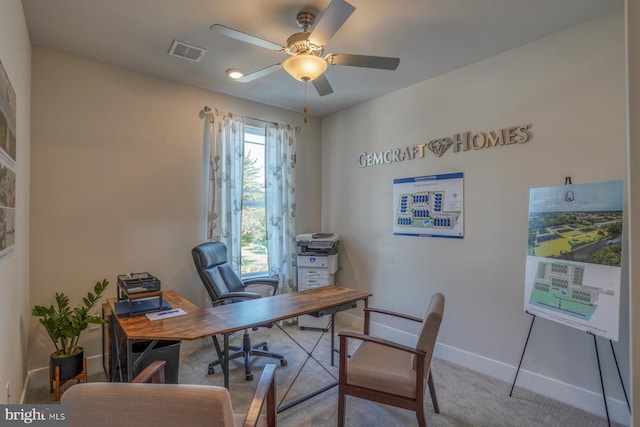 home office featuring carpet, ceiling fan, and plenty of natural light