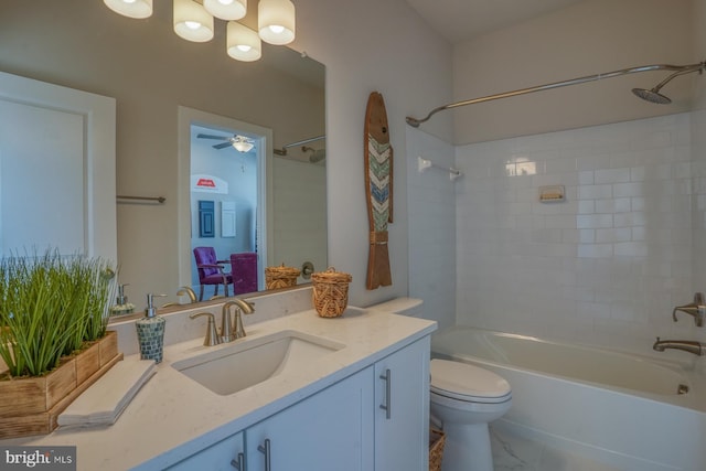 full bathroom with tile patterned flooring, tiled shower / bath, toilet, vanity, and ceiling fan