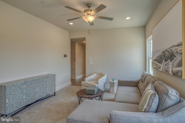 living room with baseboards, radiator, light colored carpet, a ceiling fan, and recessed lighting