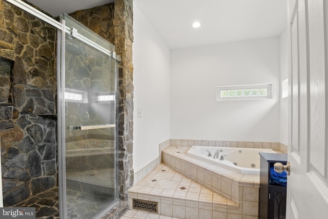 full bath with a jetted tub, recessed lighting, and a stall shower