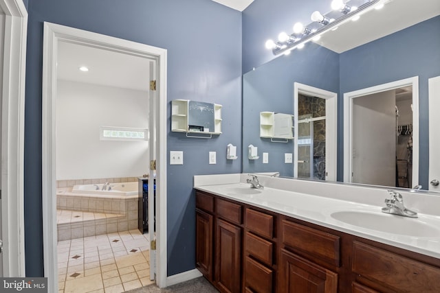 bathroom featuring tile patterned flooring, separate shower and tub, and vanity