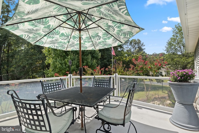 wooden terrace with outdoor dining area