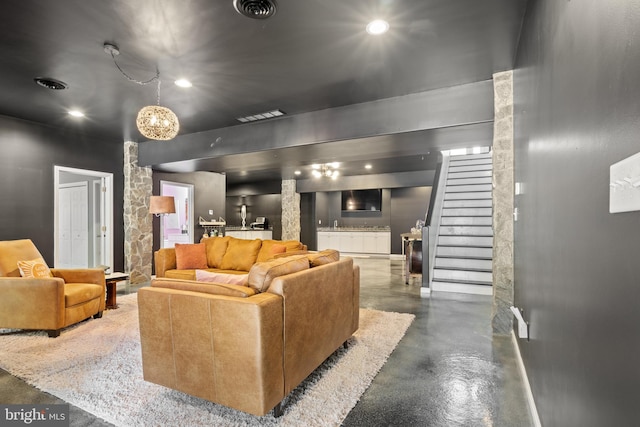 living room featuring concrete floors