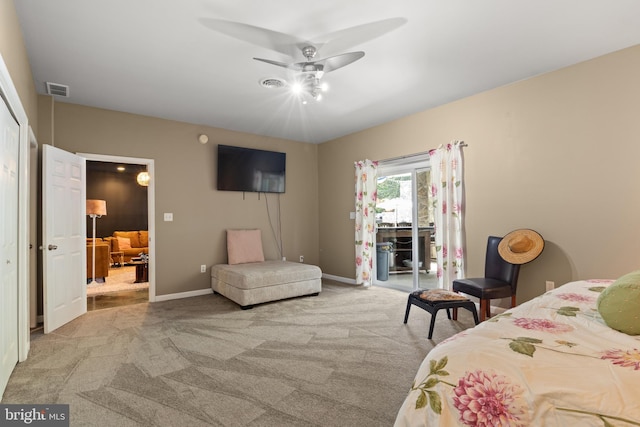 carpeted bedroom featuring access to outside, visible vents, ceiling fan, and baseboards