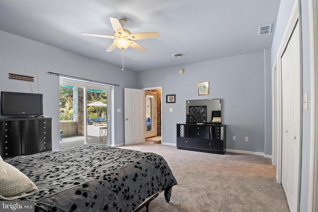 bedroom with a closet, ceiling fan, light colored carpet, and access to exterior