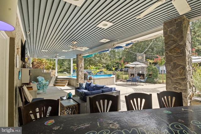 view of patio / terrace with a ceiling fan, outdoor dining area, outdoor lounge area, and an outdoor pool