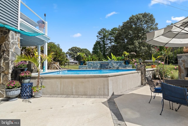 view of pool featuring a patio area