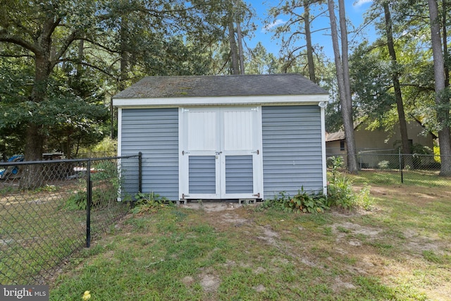 view of shed with fence