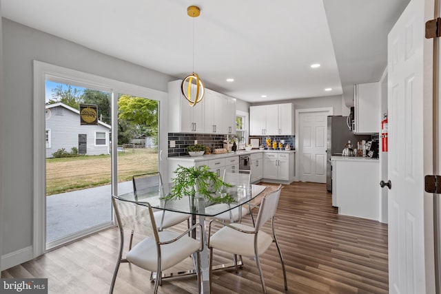 dining area with dark hardwood / wood-style floors