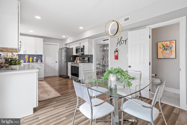 dining area featuring light hardwood / wood-style floors