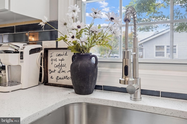 interior details featuring light stone countertops