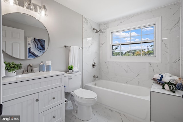 full bathroom with vanity, toilet, and tiled shower / bath