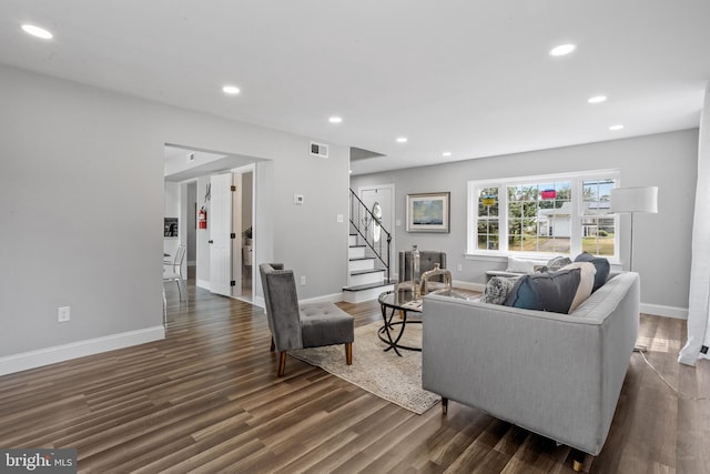 living room with dark hardwood / wood-style floors