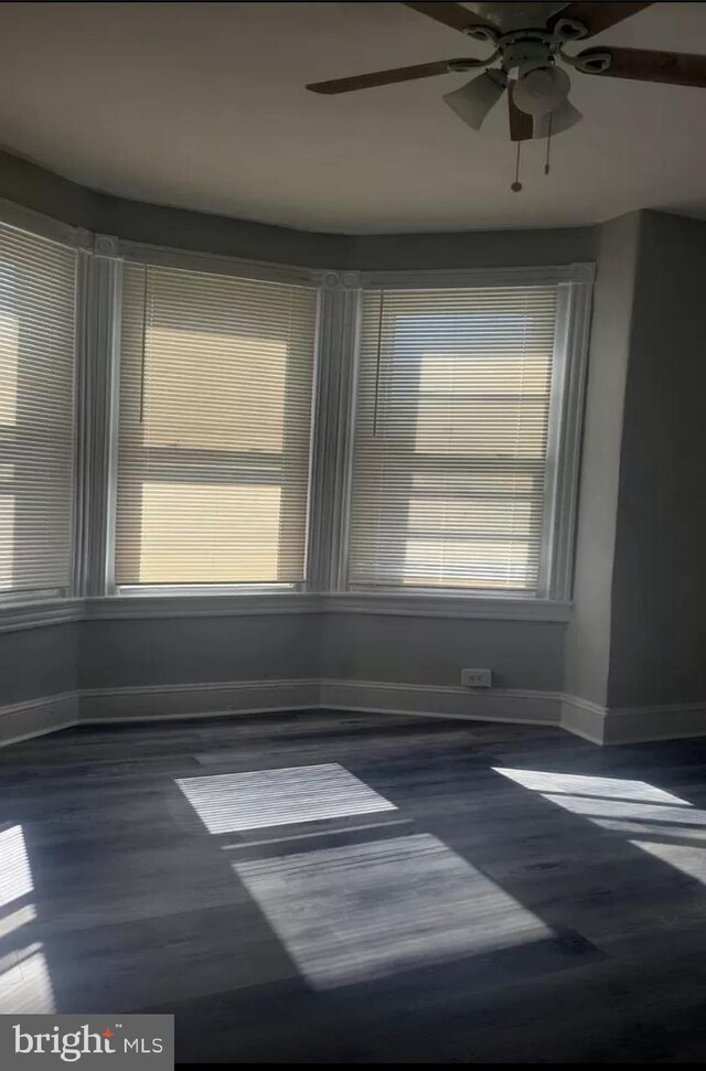 spare room featuring ceiling fan and wood-type flooring