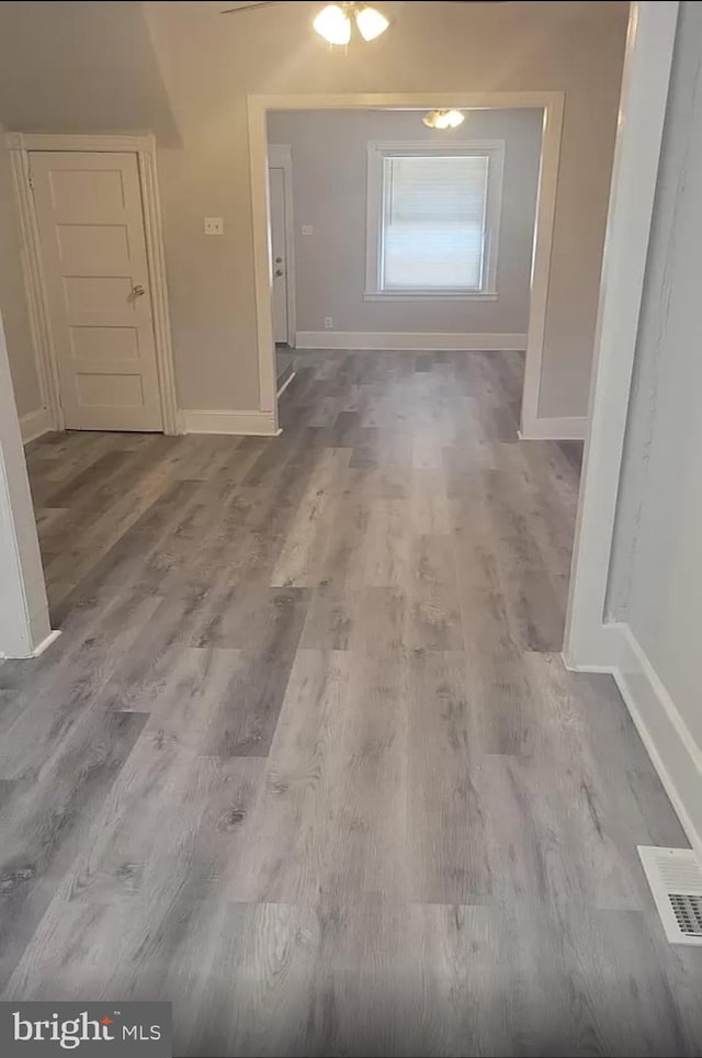 hallway featuring hardwood / wood-style flooring