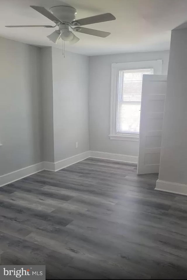 spare room featuring ceiling fan and hardwood / wood-style flooring