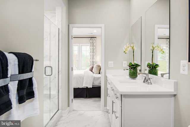 bathroom featuring double sink vanity, an enclosed shower, and tile patterned floors