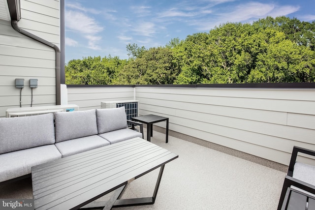 wooden terrace featuring an outdoor living space