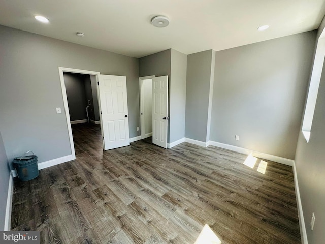 unfurnished bedroom with wood-type flooring