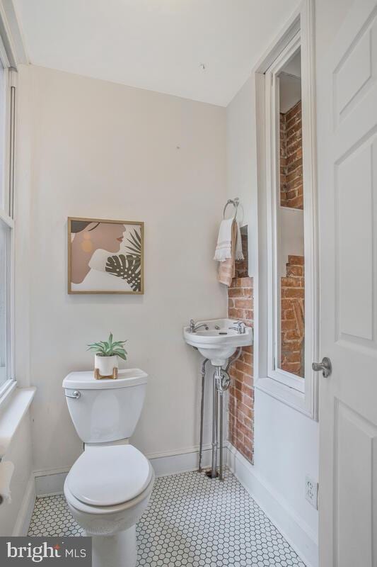 bathroom with tile patterned flooring and toilet