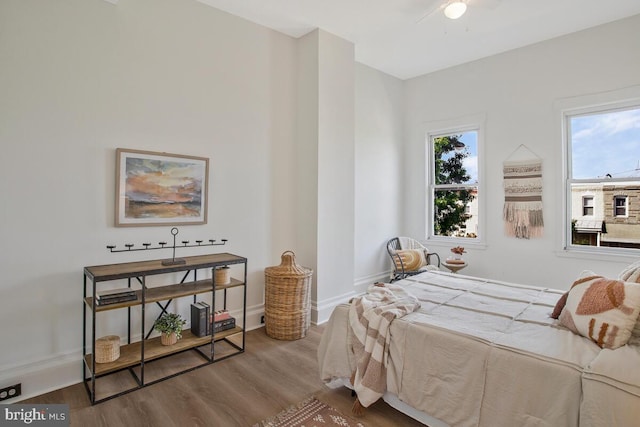 bedroom with ceiling fan and hardwood / wood-style floors