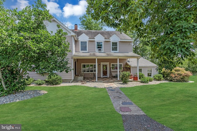 view of front of house featuring a porch and a front lawn