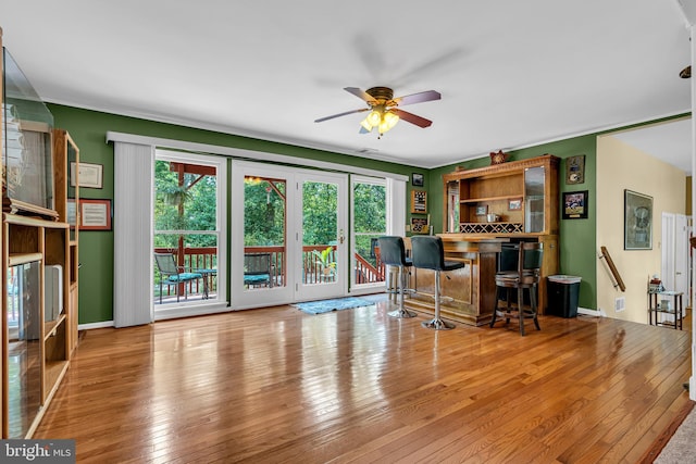 office area with light wood-type flooring and ceiling fan