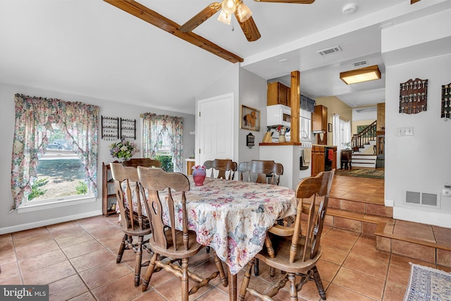 dining room featuring light tile patterned flooring, ceiling fan, and vaulted ceiling with beams