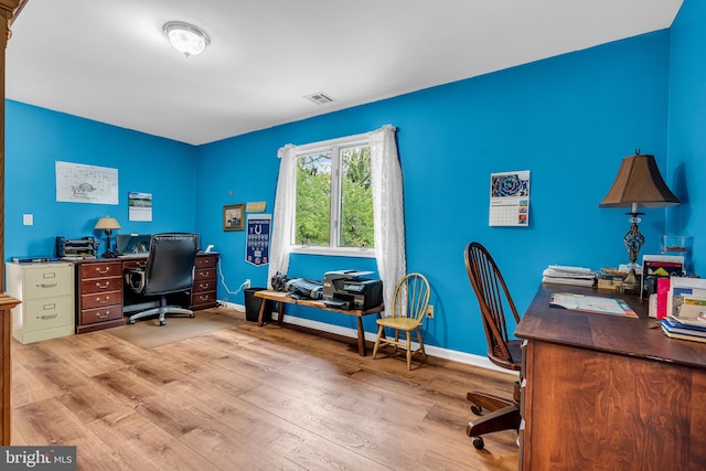 home office featuring light hardwood / wood-style flooring